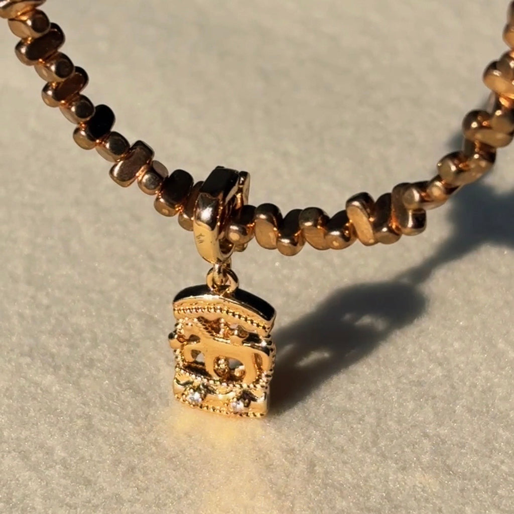 Luminous Gold Carousel Hematite Bead Necklace