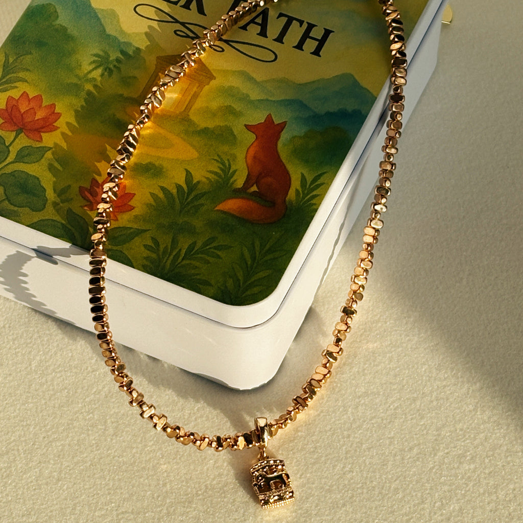 Luminous Gold Carousel Hematite Bead Necklace