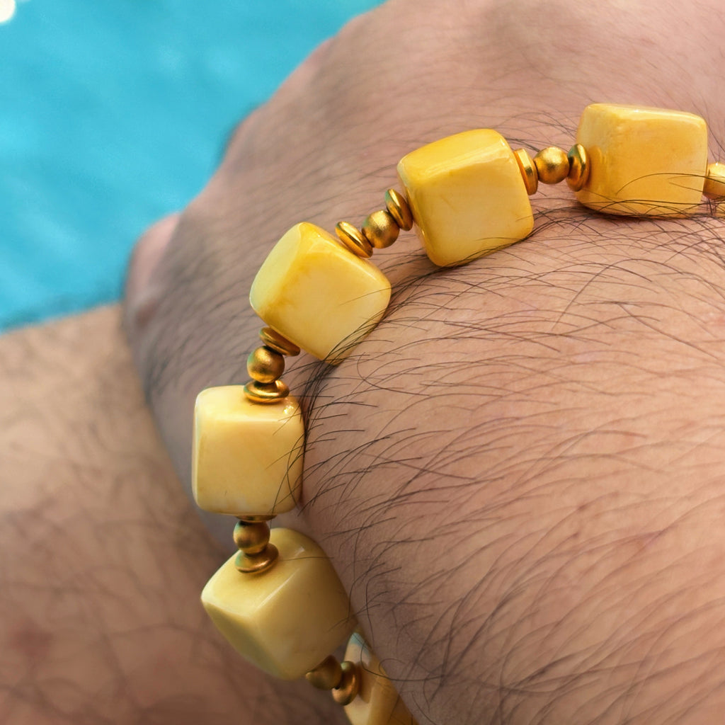 Shell Cube Bracelet on Wrist with Gold Beads